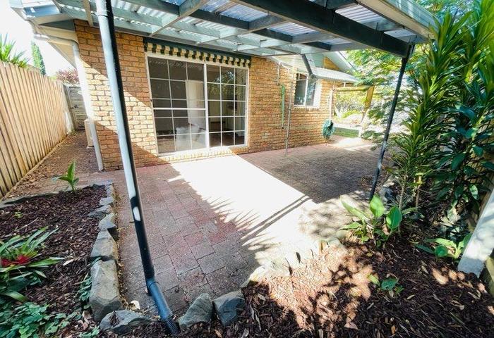 Brick home in private court location!