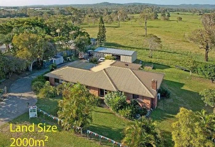 Undeveloped Acreage Style Living A Stone's Throw from Major Amenities!